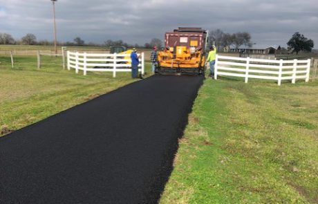 Blacktop coated drive way done by Premium Asphalt Paving.