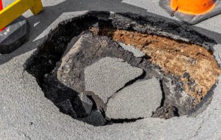 Pothole repairs by Premium Asphalt Paving.