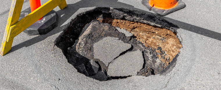 4 Reasons to Repair Potholes on Your Commercial Parking Lot