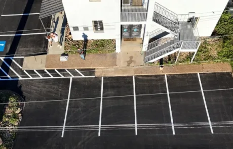 Parking spaces seal coated by Premium Asphalt Paving.